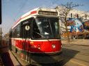 A typical Toronto streetcar, exactly the one we took to Little India / 
India Bazaar.
Although unintentional, I'm glad I got the mural in the background.
