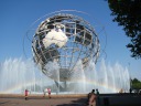 Corona Park's fountain below its giant globe.  The fountain has water!  Many people use it to cool off.  I caught a full rainbow in this shot.
