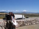 A messed-up-hair Mark, Di Yin, Mount Shasta, and truck.
