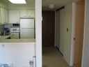 A closer view of the kitchen and the entrance hallway.
