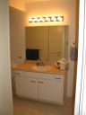 The bathroom sink and mirror.
